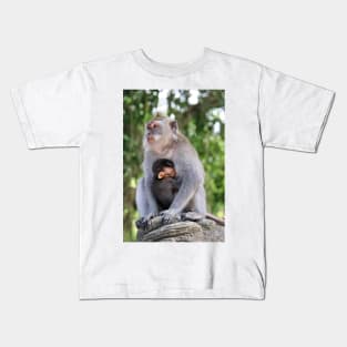 a monkey and baby sitting on a branch in ubud in bali Kids T-Shirt